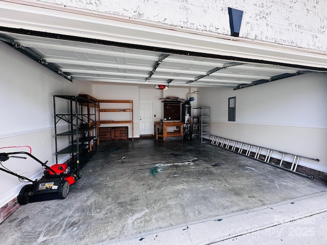 89 Woodfern Rd, Fletcher, NC 28732 - garage featuring a garage door opener and electric panel
