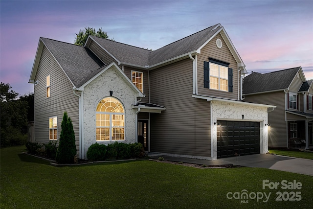 89 Woodfern Rd, Fletcher, NC 28732 - traditional home featuring driveway, a front lawn, a garage, and a shingled roof