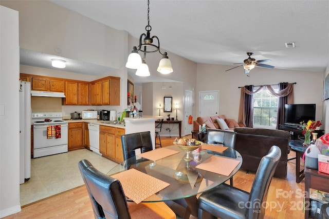 15248 Pangborn Pl, Charlotte, NC 28278 - dining area with lofted ceiling, a ceiling fan, and light wood finished floors