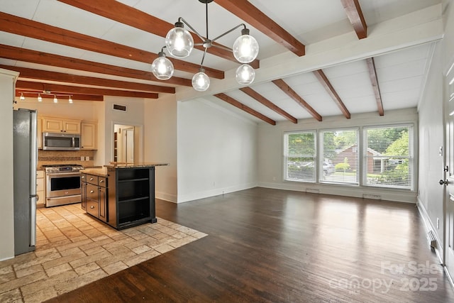 5229 Milford Rd, Charlotte, NC 28210 - kitchen with appliances with stainless steel finishes, a center island, decorative backsplash, light stone counters, and light wood-type flooring