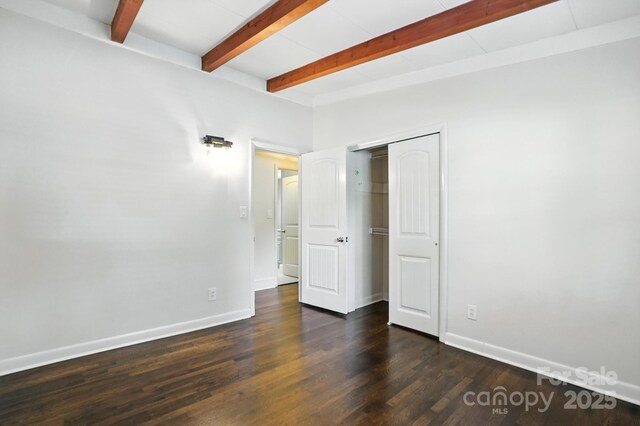 5229 Milford Rd, Charlotte, NC 28210 - unfurnished bedroom featuring beam ceiling, wood finished floors, and a closet