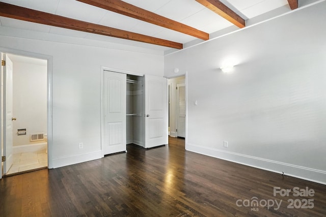 5229 Milford Rd, Charlotte, NC 28210 - unfurnished bedroom with wood finished floors, a closet, and beamed ceiling