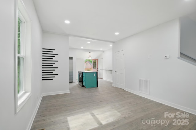308 Hickory St, Granite Falls, NC 28630 - spare room featuring light wood-type flooring and recessed lighting