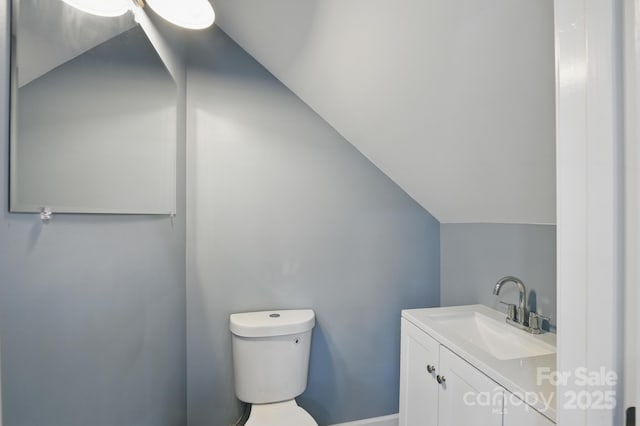 308 Hickory St, Granite Falls, NC 28630 - bathroom featuring vanity and vaulted ceiling