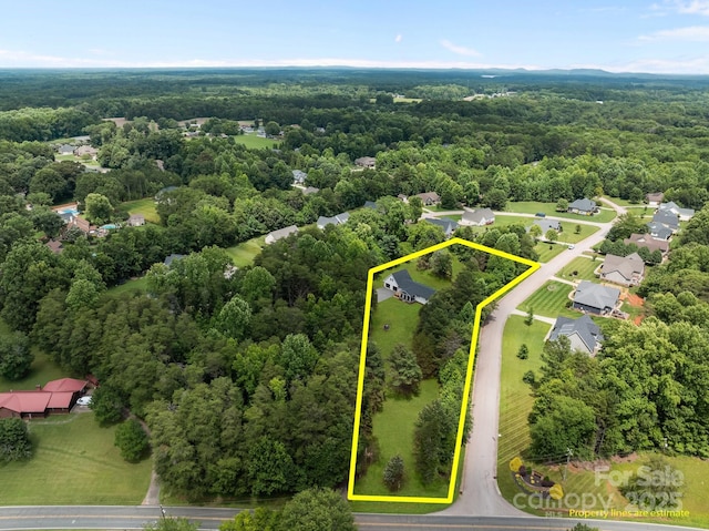 1115 Sides Rd, Salisbury, NC 28146 - aerial view of property and surrounding area featuring a forest and property boundaries highlighted
