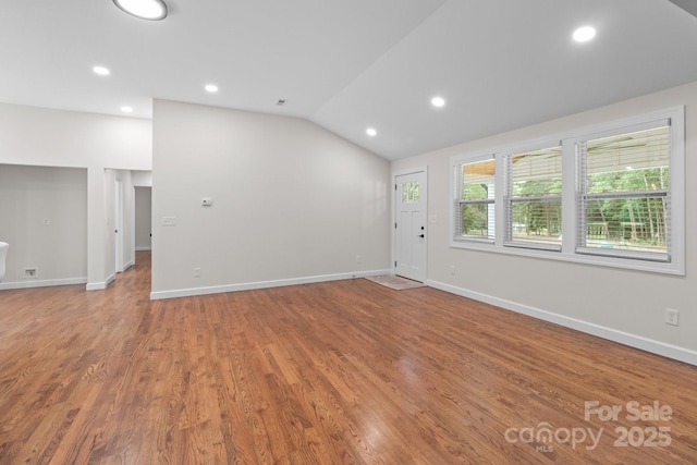 1115 Sides Rd, Salisbury, NC 28146 - unfurnished living room featuring lofted ceiling, light wood-style floors, and recessed lighting