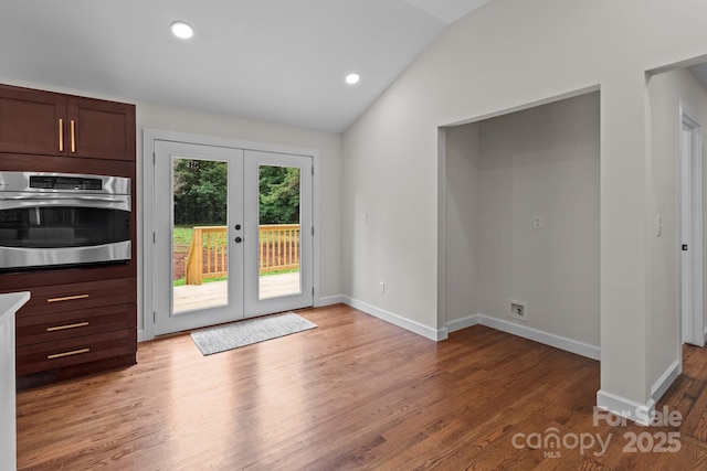 1115 Sides Rd, Salisbury, NC 28146 - unfurnished dining area with vaulted ceiling, french doors, light wood-style flooring, and recessed lighting