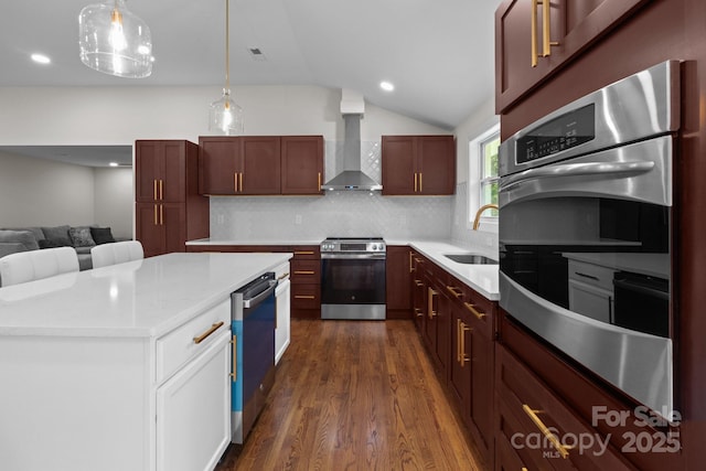 1115 Sides Rd, Salisbury, NC 28146 - kitchen with appliances with stainless steel finishes, wall chimney range hood, dark wood-style floors, lofted ceiling, and backsplash