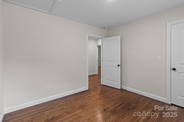 1115 Sides Rd, Salisbury, NC 28146 - unfurnished bedroom featuring dark wood-style floors and attic access
