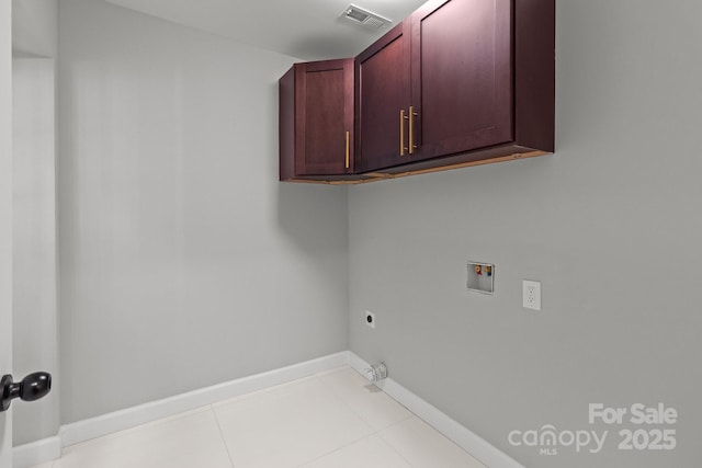 1115 Sides Rd, Salisbury, NC 28146 - washroom with cabinet space, washer hookup, electric dryer hookup, tile patterned flooring, and hookup for a gas dryer