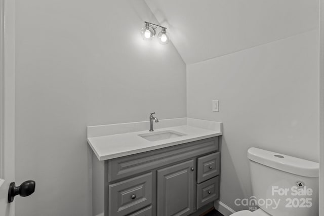 1115 Sides Rd, Salisbury, NC 28146 - bathroom featuring lofted ceiling and vanity