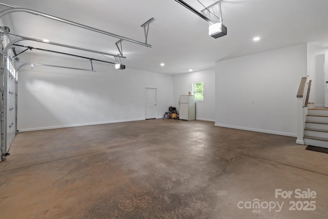 1115 Sides Rd, Salisbury, NC 28146 - garage with freestanding refrigerator, a garage door opener, and recessed lighting