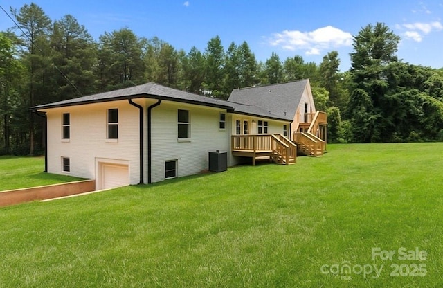 1115 Sides Rd, Salisbury, NC 28146 - back of property with an attached garage, a deck, a yard, brick siding, and stairway