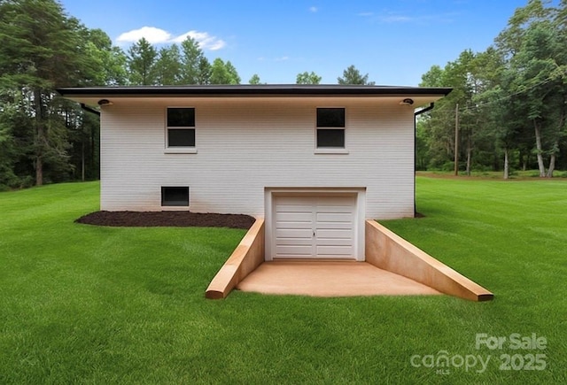 1115 Sides Rd, Salisbury, NC 28146 - rear view of property featuring an attached garage and a yard