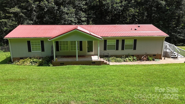 184 Winding Arbor Cir, Cleveland, NC 27013 - view of front of property featuring crawl space, a metal roof, and a front yard