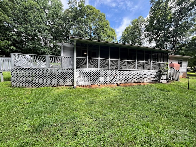 184 Winding Arbor Cir, Cleveland, NC 27013 - rear view of property with a wooden deck and a lawn