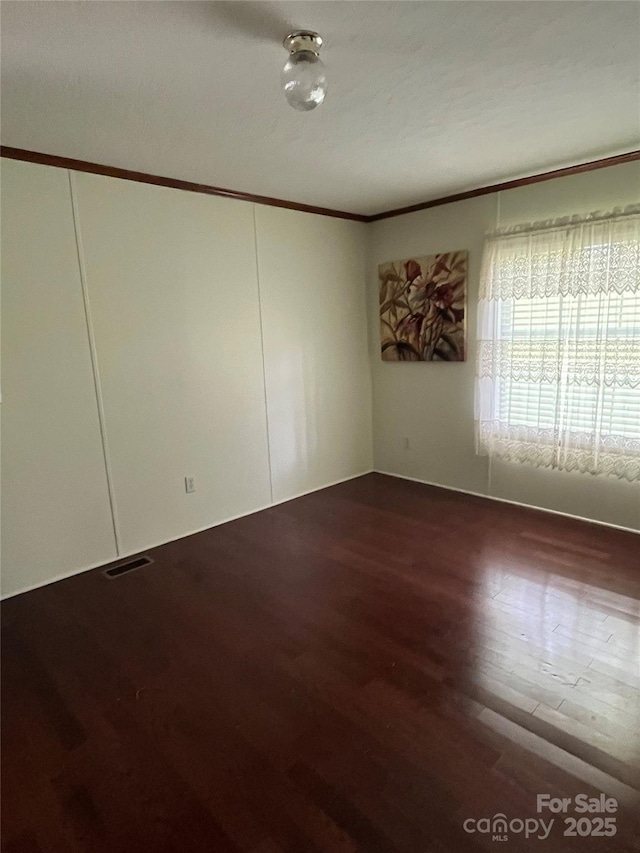 184 Winding Arbor Cir, Cleveland, NC 27013 - unfurnished room featuring wood finished floors and ornamental molding