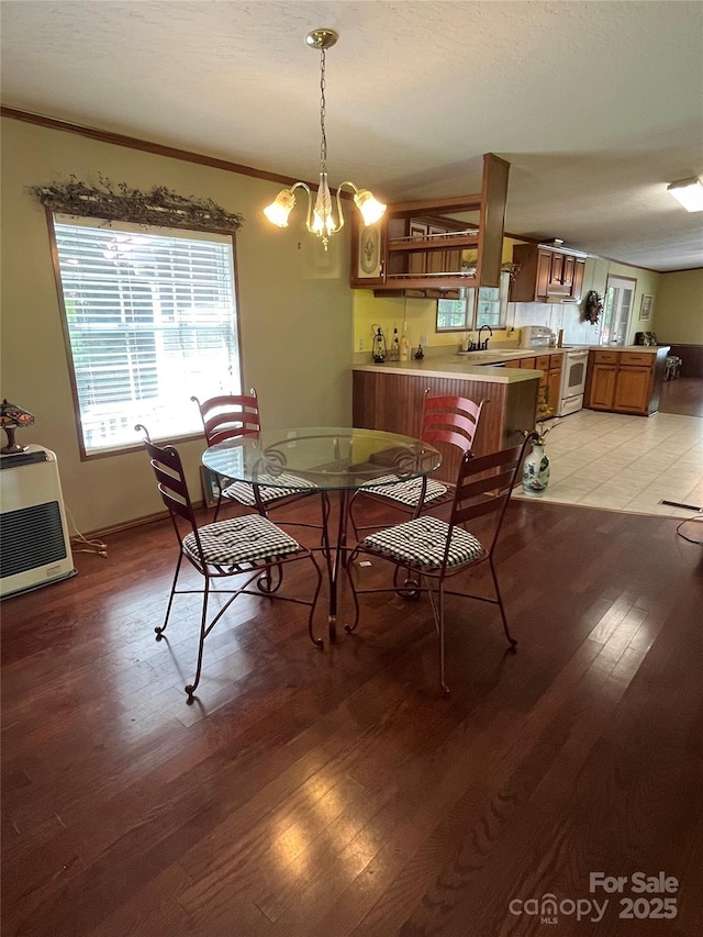 184 Winding Arbor Cir, Cleveland, NC 27013 - dining space featuring light wood-type flooring, heating unit, ornamental molding, and a chandelier
