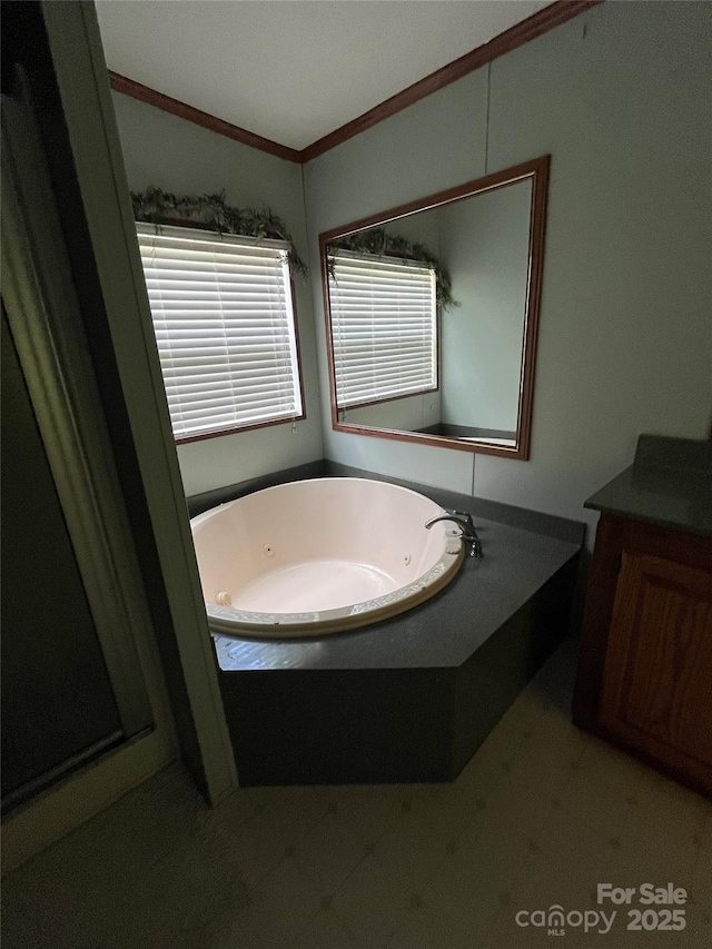 184 Winding Arbor Cir, Cleveland, NC 27013 - bathroom featuring tile patterned floors, a jetted tub, vanity, and ornamental molding