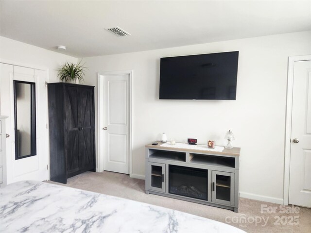 1047 Campbell Chase Ln SW, Concord, NC 28025 - bedroom featuring light carpet and baseboards