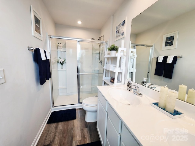 1047 Campbell Chase Ln SW, Concord, NC 28025 - bathroom featuring wood finished floors, vanity, and a shower stall