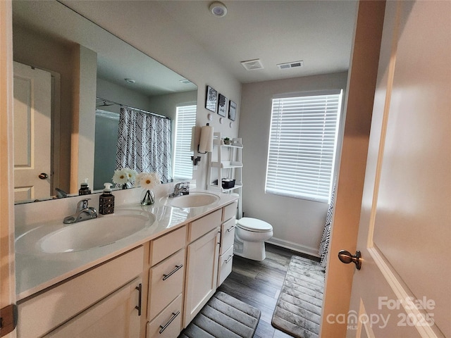 1047 Campbell Chase Ln SW, Concord, NC 28025 - bathroom with double vanity, wood finished floors, and curtained shower