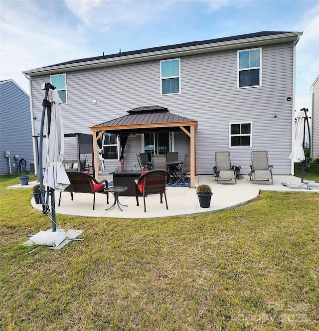 1047 Campbell Chase Ln SW, Concord, NC 28025 - rear view of property featuring a gazebo, a patio, and a lawn