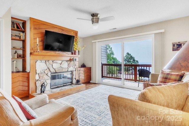 2881 White Oak Mountain Rd Unit D5, Columbus, NC 28722 - living area with ceiling fan, wood finished floors, a fireplace, and built in shelves