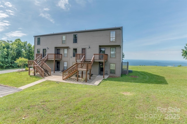 2881 White Oak Mountain Rd Unit D5, Columbus, NC 28722 - back of house featuring stairway, a yard, and a deck