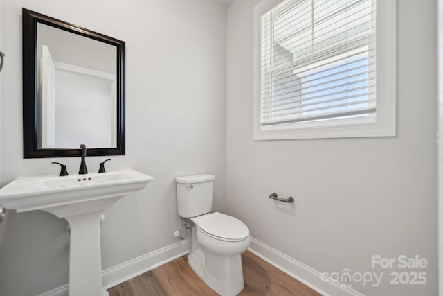 308 Alameda Way, Matthews, NC 28104 - half bathroom with baseboards and wood finished floors