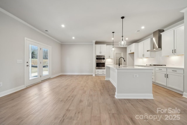308 Alameda Way, Matthews, NC 28104 - kitchen with wall chimney exhaust hood, stovetop, stainless steel double oven, crown molding, and tasteful backsplash