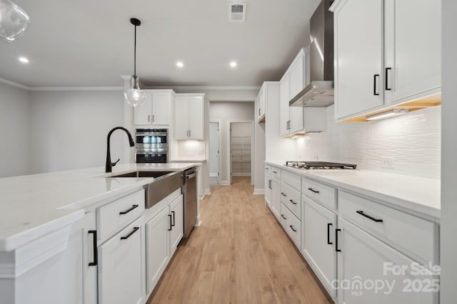 308 Alameda Way, Matthews, NC 28104 - kitchen featuring wall chimney exhaust hood, stainless steel appliances, backsplash, recessed lighting, and light wood finished floors
