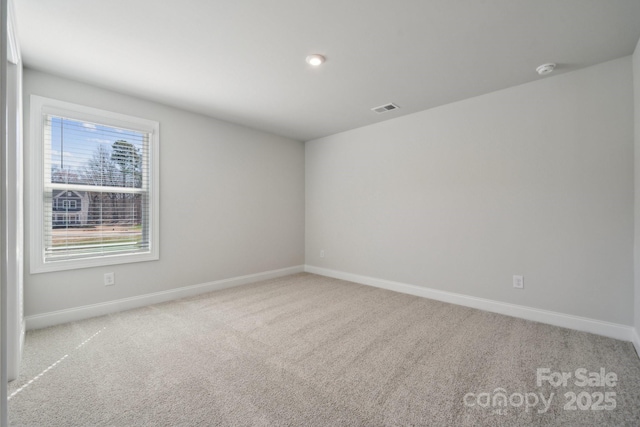 308 Alameda Way, Matthews, NC 28104 - carpeted spare room featuring baseboards and a smoke detector