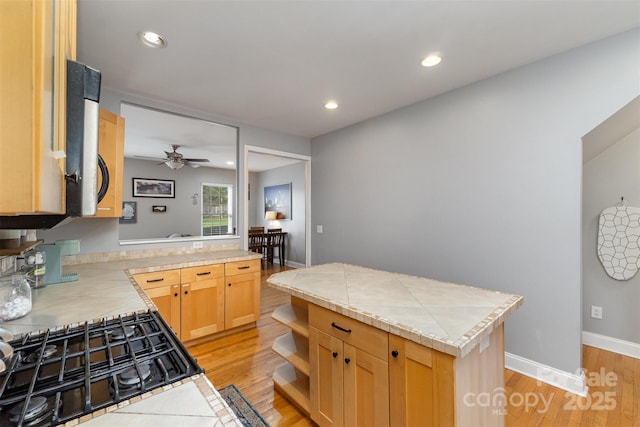 501 Mercury St, Charlotte, NC 28205 - kitchen with light wood-style flooring, stovetop, recessed lighting, ceiling fan, and open shelves