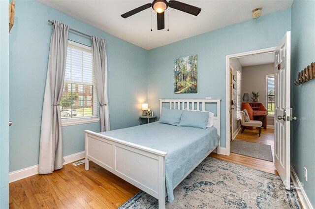 501 Mercury St, Charlotte, NC 28205 - bedroom with light wood-type flooring and a ceiling fan