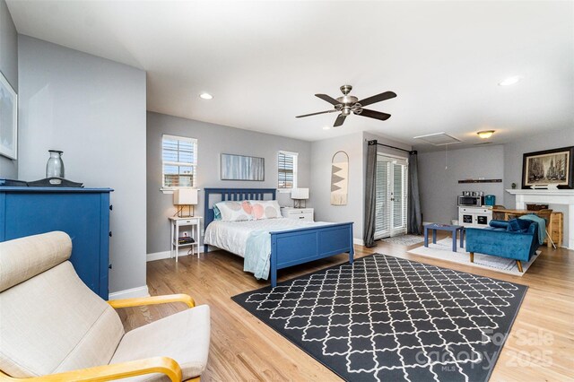501 Mercury St, Charlotte, NC 28205 - bedroom with attic access, wood finished floors, recessed lighting, and a ceiling fan