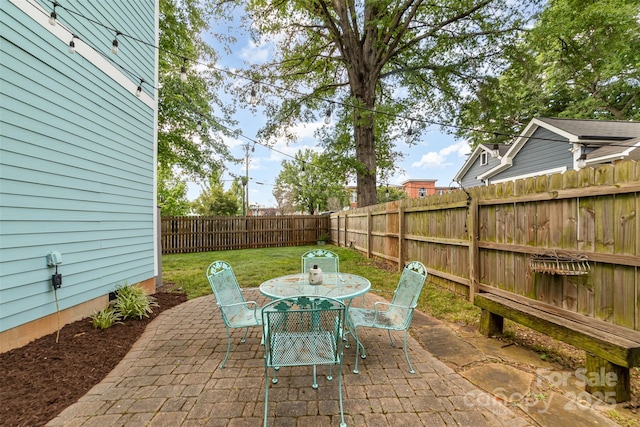 501 Mercury St, Charlotte, NC 28205 - fenced backyard featuring a patio and outdoor dining area