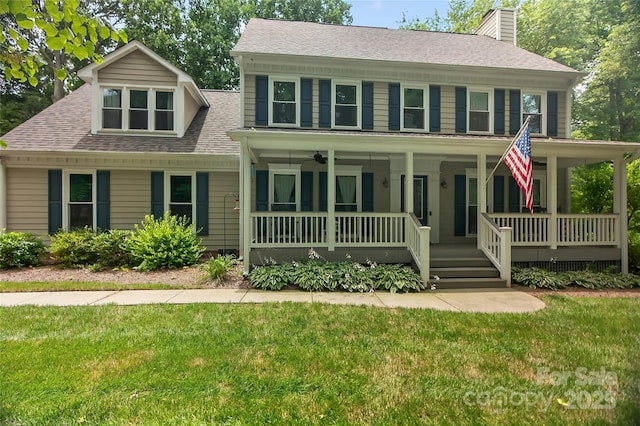 8300 Quarters Ln, Mint Hill, NC 28227 - colonial inspired home featuring covered porch, a chimney, a front yard, and roof with shingles