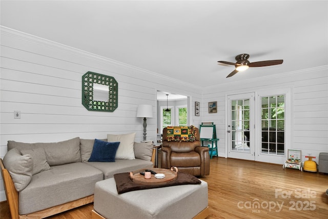 8300 Quarters Ln, Mint Hill, NC 28227 - living room with crown molding, ceiling fan, wood finished floors, and wood walls
