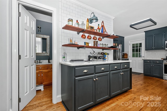 8300 Quarters Ln, Mint Hill, NC 28227 - kitchen featuring open shelves, backsplash, light countertops, appliances with stainless steel finishes, and ornamental molding
