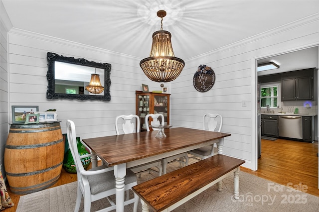 8300 Quarters Ln, Mint Hill, NC 28227 - dining room with a chandelier, ornamental molding, light wood-style floors, and wood walls