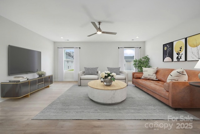 204 Coronado Ave, Matthews, NC 28104 - living room with wood finished floors, ceiling fan, and recessed lighting