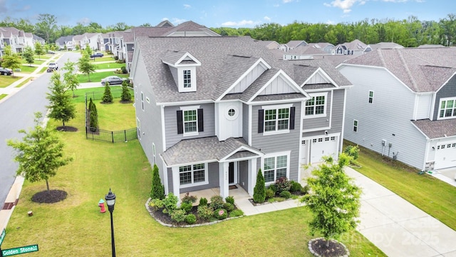8420 Golden Stone Ln Unit 138, Fort Mill, SC 29707 - view of front of house featuring a residential view, a garage, concrete driveway, board and batten siding, and a shingled roof