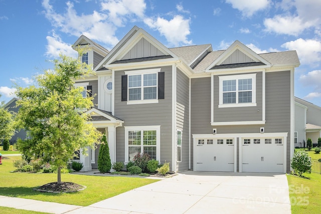 8420 Golden Stone Ln Unit 138, Fort Mill, SC 29707 - view of front of house with board and batten siding, a front yard, an attached garage, and driveway