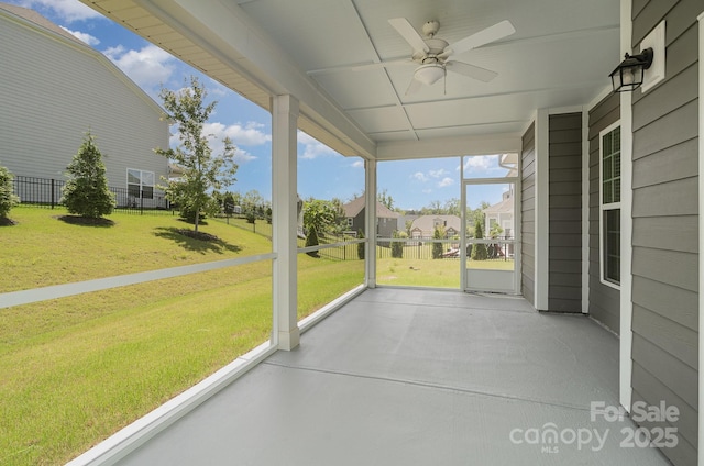 8420 Golden Stone Ln Unit 138, Fort Mill, SC 29707 - unfurnished sunroom featuring ceiling fan and a residential view