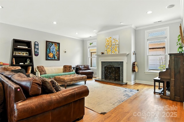 1009 13th Avenue Pl NW Unit 19, Hickory, NC 28601 - living area with light wood-style flooring, a fireplace with raised hearth, recessed lighting, and ornamental molding