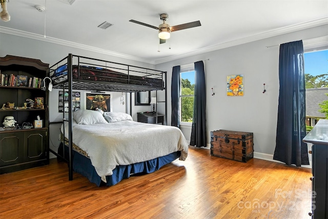 1009 13th Avenue Pl NW Unit 19, Hickory, NC 28601 - bedroom featuring multiple windows, ornamental molding, wood finished floors, and a ceiling fan