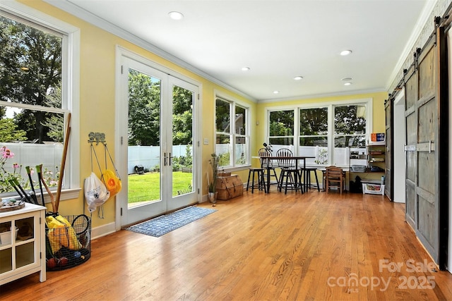 1009 13th Avenue Pl NW Unit 19, Hickory, NC 28601 - sunroom with a barn door, french doors, ornamental molding, wood finished floors, and a wooden deck