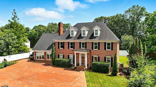 1009 13th Avenue Pl NW Unit 19, Hickory, NC 28601 - colonial house with brick siding, a chimney, a fenced backyard, and driveway