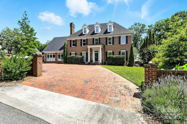 1009 13th Avenue Pl NW Unit 19, Hickory, NC 28601 - colonial home featuring brick siding, decorative driveway, a chimney, and a front yard